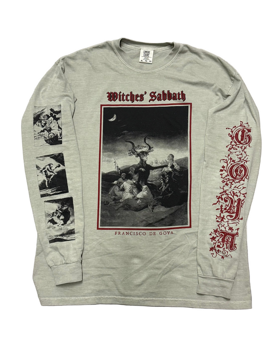 Long-sleeve shirt with 'Witches' Sabbath' design on a wooden floor